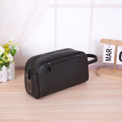 FingerLock clutch in Black, three-quarter view with the fingerprint sensor visible