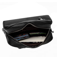 FingerLock clutch open, showing the interior with cards and a phone